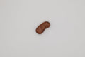 wooden bean on a light gray background