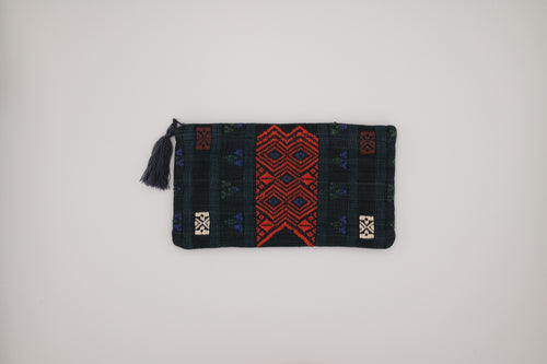 Chin textile pouch with red, green and blue patterns on a light gray background