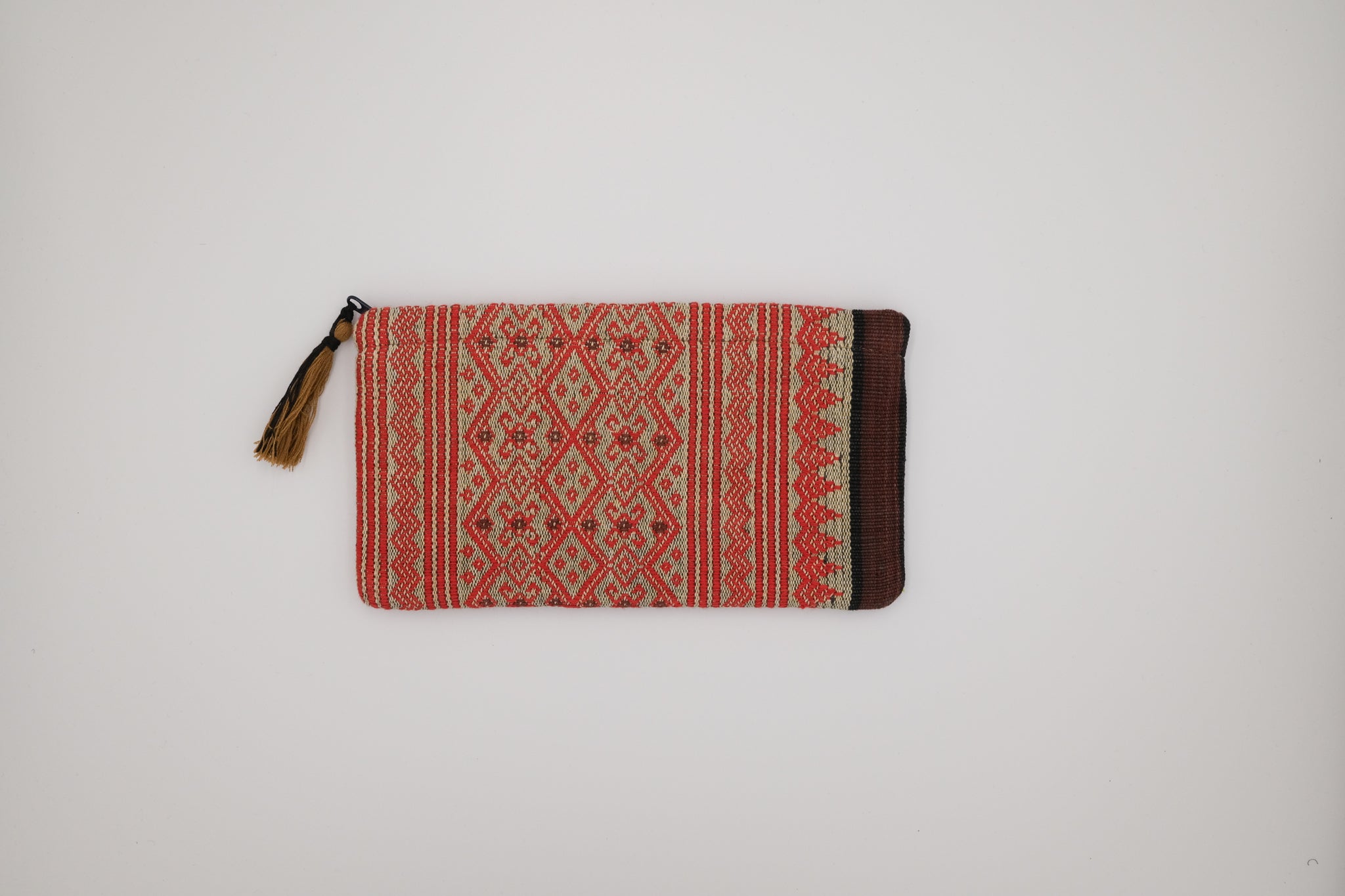 Woven pouch with geometric pattern on a white background