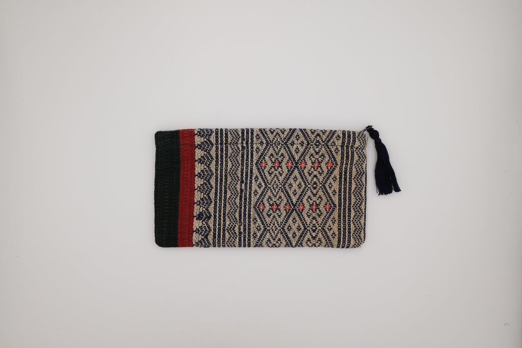 Woven pouch with geometric pattern on a white background