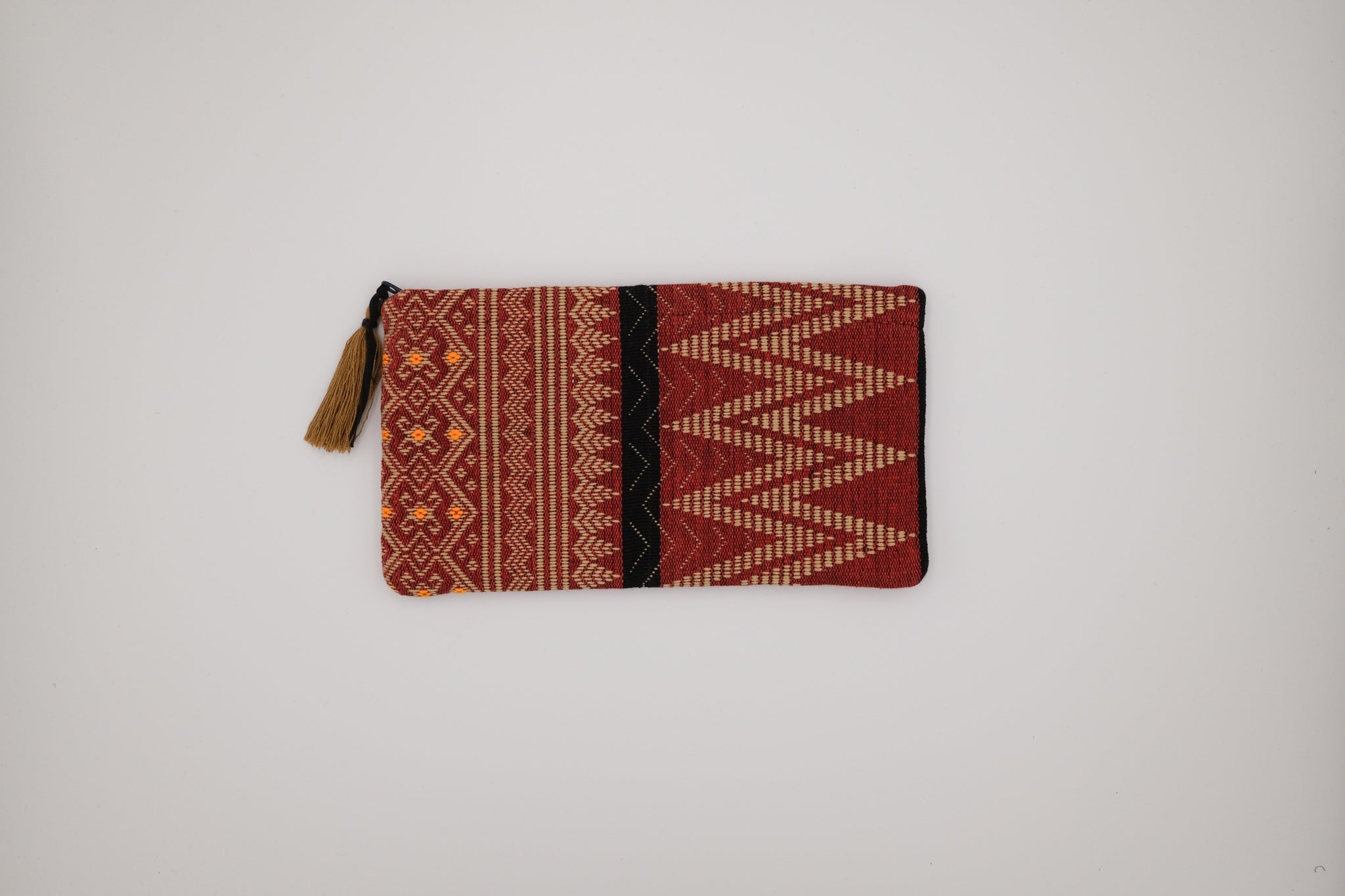 Textured pouch with geometric pattern on a plain background