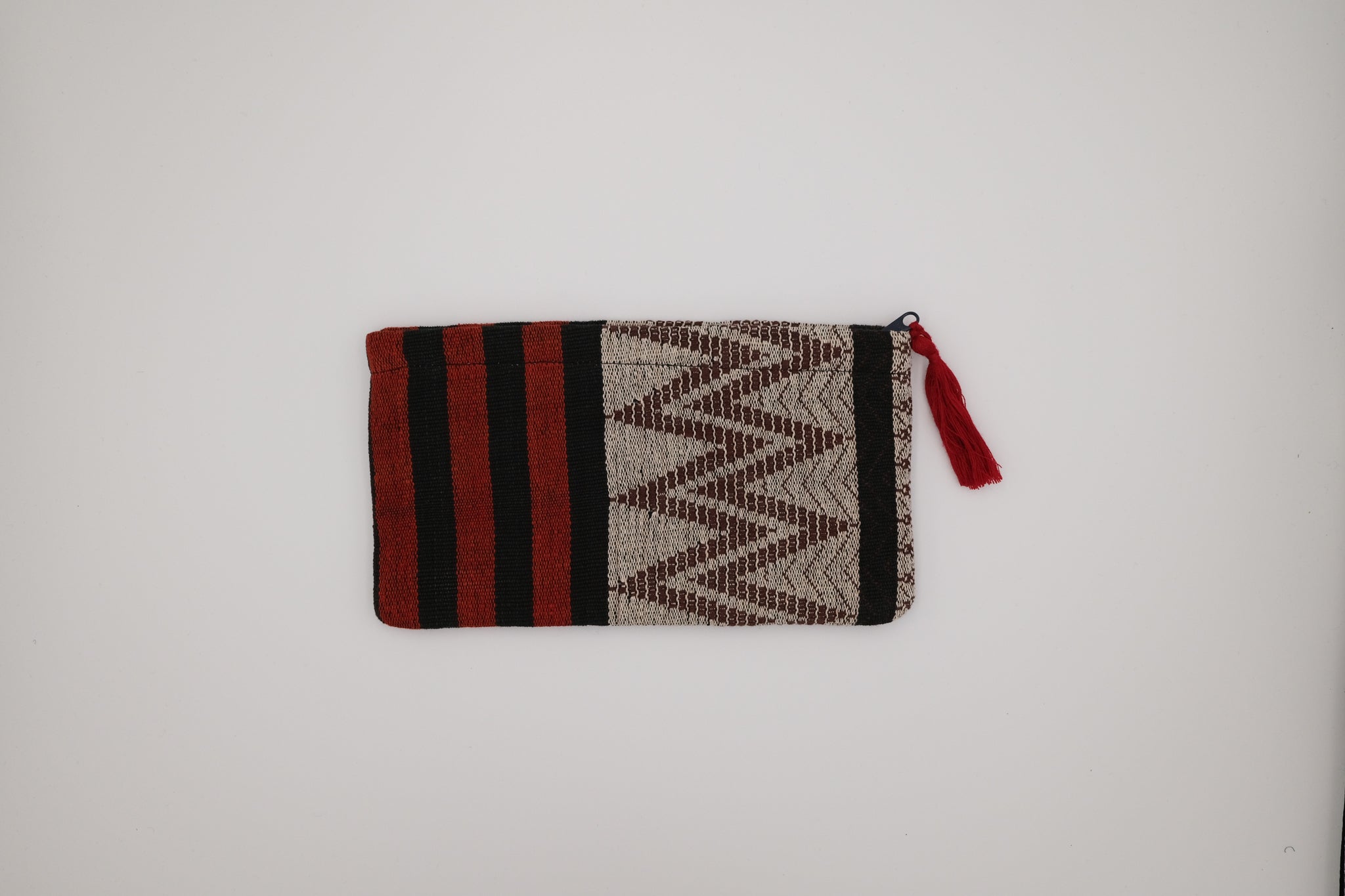 Woven pouch with red, black, and beige pattern on a white background