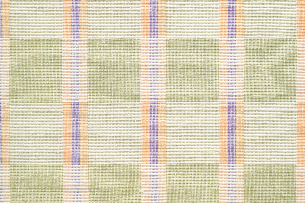 Textured fabric with green, orange, and purple plaid pattern