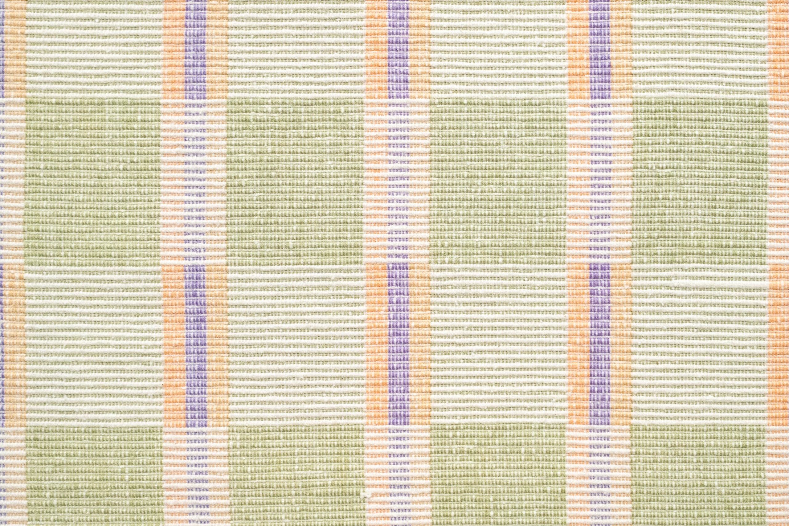 Textured fabric with green, orange, and purple plaid pattern